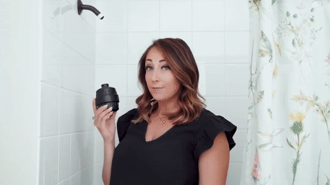 Attaching the filter to the shower arm and reattaching the shower head